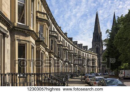 Stock Photograph - Residential buildings and towers of a church; Edinburgh, Scotland. Fotosearch