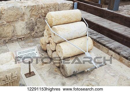 Stock Photograph - Rollers for compressing plaster on roofs and floors from the Hellenistic period found at Mount Gerizim; Israel. Fotosearch