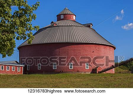 Stock Photograph - Round red barn; West Brome, Quebec, Canada. Fotosearch