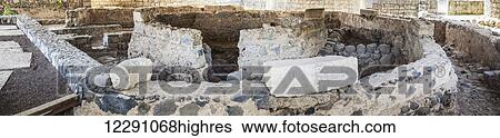 Stock Photograph - Ruins believed to be the location of Peters house, excavated in Capernaum, now protected by a church that is built over it; Capernaum, Israel. Fotosearch