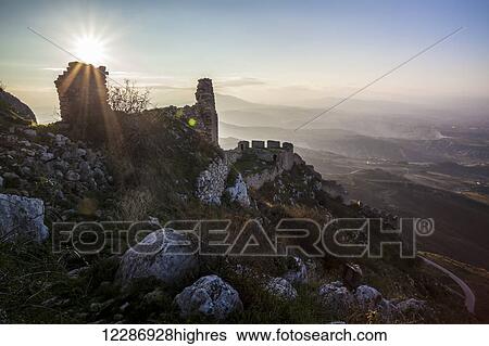 Ruins of a stone building and sunburst; Corinth, Greece View Large Photo Image Stock Photograph - Ruins of a stone building and sunburst; Corinth, Greece. Fotosearch