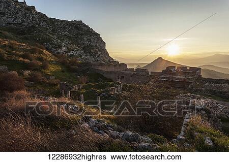Ruins of stone buildings and walls at sunset; Corinth, Greece View Large Photo Image Stock Photograph - Ruins of stone buildings and walls at sunset; Corinth, Greece. Fotosearch