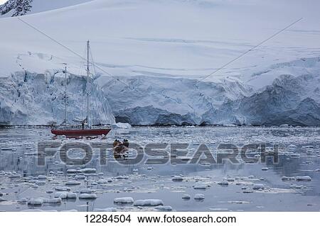 Sailboat and zodiac at Port Lockroy, Antarctic Peninsula; Antarctica View Large Photo Image Picture - Sailboat and zodiac at Port Lockroy, Antarctic Peninsula; Antarctica. Fotosearch