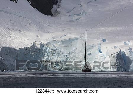 Stock Photography - Sailboat in Paradise Harbor, Antarctic Peninsula; Antarctica. Fotosearch