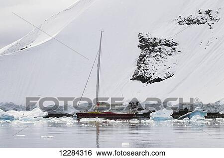 Sailboat near Port Lockroy, Antarctic Peninsula; Antarctica View Large Photo Image Stock Photograph - Sailboat near Port Lockroy, Antarctic Peninsula; Antarctica. Fotosearch