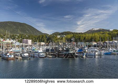 Sailboats and fishing boats docked in Ketchikan's harbor along Creek Street, Southeast Alaska, Spring View Large Photo Image Stock Photograph - Sailboats and fishing boats docked in Ketchikan's harbor along Creek Street, Southeast Alaska, Spring. Fotosearch