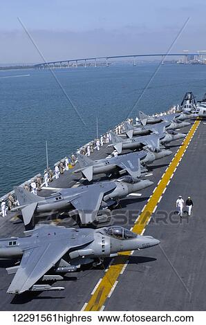 Sailors and marines onboard the USS Peleliu (LHA-5) man the rails on the flight deck as the ship leaves port; San Diego, California, United States of America View Large Photo Image Stock Photograph - Sailors and marines onboard the USS Peleliu (LHA-5) man the rails on the flight deck as the ship leaves port; San Diego, California, United States of America. Fotosearch