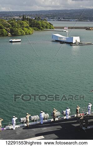 Stock Photograph - Sailors and Marines render honors to the USS Arizona Memorial in Pearl Harbor; Oahu, Hawaii, United States of America. Fotosearch