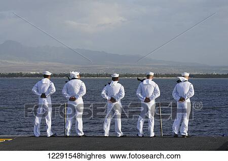 Sailors man the rails in dress whites as the ship comes into Pearl Harbor; Oahu, Hawaii, United States of America View Large Photo Image Stock Photograph - Sailors man the rails in dress whites as the ship comes into Pearl Harbor; Oahu, Hawaii, United States of America. Fotosearch