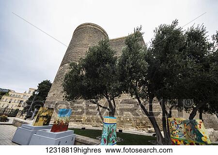 Stock Photograph - Scale models of the Maiden Tower painted by various artists by the Maiden Tower; Baku, Azerbaijan. Fotosearch