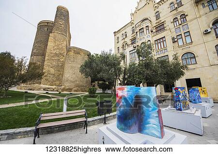 Stock Photograph - Scale models of the Maiden Tower painted by various artists by the Maiden Tower and House of Hajinsky; Baku, Azerbaijan. Fotosearch