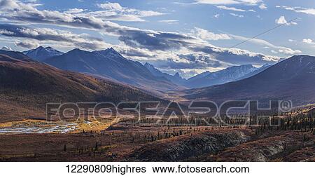 Stock Photograph - Scenic autumn view of mountains and colorful tundra in Tombstone Territorial Park, Yukon Territory, Canada. Fotosearch