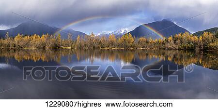 Scenic view of autumn rain showers and a rainbow reflected in Moose Lake, Mendenhall Recreation Area, Tongass National Forest, Juneau, Southeast Alaska View Large Photo Image Stock Photograph - Scenic view of autumn rain showers and a rainbow reflected in Moose Lake, Mendenhall Recreation Area, Tongass National Forest, Juneau, Southeast Alaska. Fotosearch