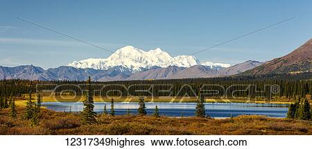 Stock Photograph - Scenic view of Denali and a pond at Broad Pass along Parks Highway, Interior Alaska, USA. Fotosearch