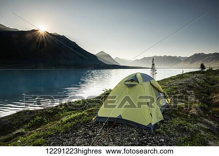 Scenic view of Lower Twin Lake with a backpacking tent in the foreground, Lake Clark National Park & Preserve, Southcentral Alaska View Large Photo Image Stock Photograph - Scenic view of Lower Twin Lake with a backpacking tent in the foreground, Lake Clark National Park & Preserve, Southcentral Alaska. Fotosearch