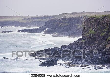Scenic view of the Bering Sea with mist and fog among the waves breaking on shore, St. Paul Island, Southwestern Alaska, USA, Summer View Large Photo Image Stock Photo - Scenic view of the Bering Sea with mist and fog among the waves breaking on shore, St. Paul Island, Southwestern Alaska, USA, Summer. Fotosearch