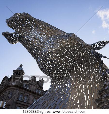 Stock Photograph - Sculpture of a horse head and a building in the background; Edinburgh, Scotland. Fotosearch