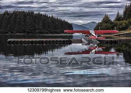 Stock Photograph - Seaplane moored in the Kodiak harbor, Kodiak Island, Southcentral Alaska, USA. Fotosearch