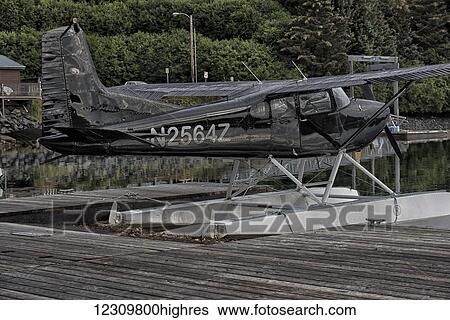 Stock Photograph - Seaplane moored in the Kodiak harbor, Kodiak Island, Southcentral Alaska, USA. Fotosearch