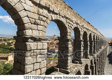 Stock Photograph - Segovia's Aqueduct is one of the architectural symbols of Spain, built in the 2nd Century A. D; Segovia city, Castilla Leon, Spain. Fotosearch