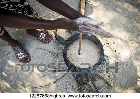 Sexaxa village African woman heating up food; Maun, Botswana View Large Photo Image Stock Photograph - Sexaxa village African woman heating up food; Maun, Botswana. Fotosearch