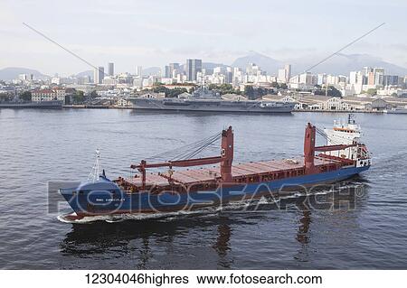 Stock Photograph - Ship leaving port and aircraft carrier; Rio de Janeiro, Brazil. Fotosearch