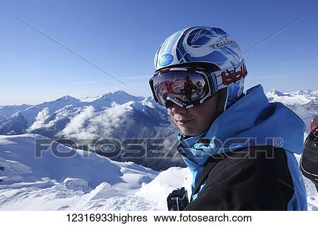 Stock Photograph - Skier at top of ski hill; Whistler, British Columbia, Canada. Fotosearch
