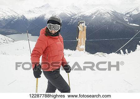 Stock Photograph - Skier on resort ski hill; Whistler, British Columbia, Canada. Fotosearch
