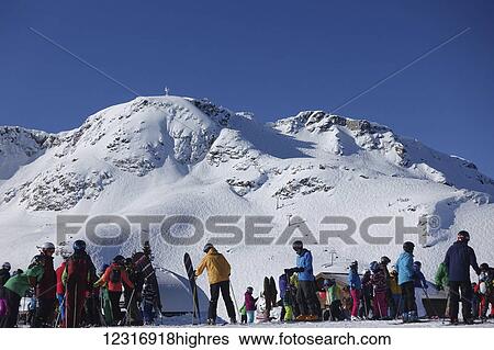 Stock Photograph - Skiers and view towards Whistler Peak chair, from Whistler Roundhouse gondola; Whistler, British Columbia, Canada. Fotosearch