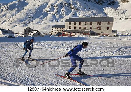 Stock Photograph - Skiers train in the Independence Mine area of Hatcher Pass, Southcentral Alaska. Winter.. Fotosearch