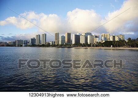 Skyline of Honolulu across the water; Honolulu, Oahu, Hawaii, United States of America View Large Photo Image Stock Photograph - Skyline of Honolulu across the water; Honolulu, Oahu, Hawaii, United States of America. Fotosearch