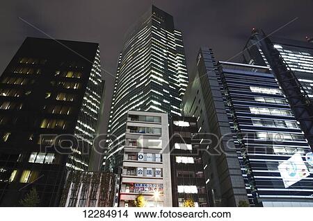 Skyscrapers illuminated at nighttime; Tokyo, Japan View Large Photo Image Picture - Skyscrapers illuminated at nighttime; Tokyo, Japan. Fotosearch
