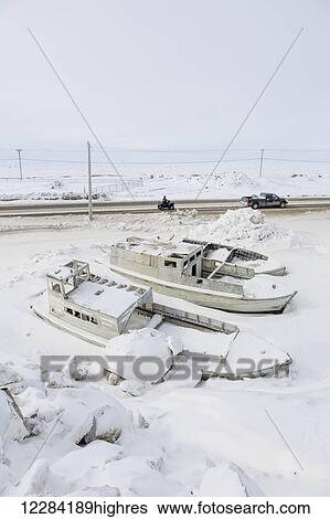 Small boats frozen in snow banks next to a road, sea ice in the background, Barrow, North Slope, Arctic Alaska, USA, Winter View Large Photo Image Stock Photograph - Small boats frozen in snow banks next to a road, sea ice in the background, Barrow, North Slope, Arctic Alaska, USA, Winter. Fotosearch