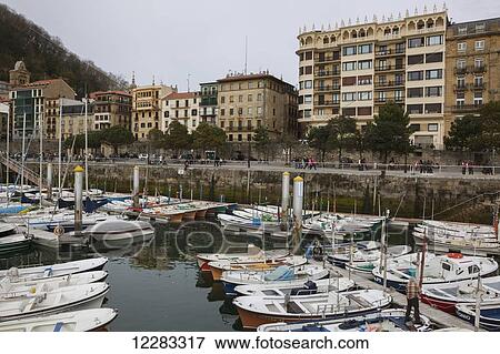 Small boats in the city's harbour in the Old Town; San Sebastian, Spain View Large Photo Image Stock Photo - Small boats in the city's harbour in the Old Town; San Sebastian, Spain. Fotosearch