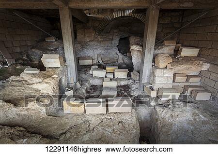 Stock Photograph - Small boxes inside a cave; Jerusalem, Israel. Fotosearch