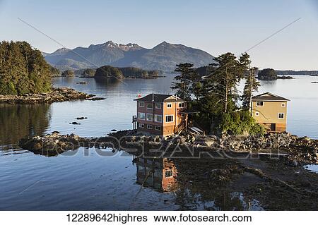 Stock Photograph - Small island with residential homes, Sitka, Southeast Alaska, Summer. Fotosearch