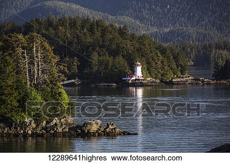 Small islands populated by Sitka spruce trees, a lighthouse in the background; Sitka, Alaska, United States of America View Large Photo Image Stock Photograph - Small islands populated by Sitka spruce trees, a lighthouse in the background; Sitka, Alaska, United States of America. Fotosearch
