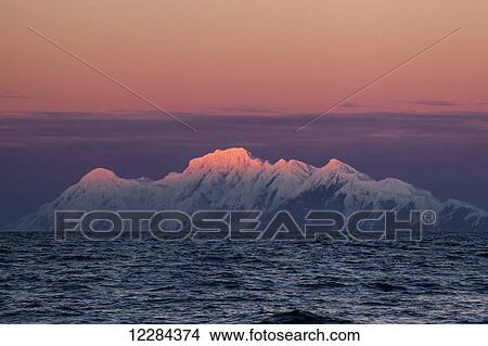 Smith Island with a pink sky and glowing mountain peaks, Antarctic Peninsula; Antarctica View Large Photo Image Picture - Smith Island with a pink sky and glowing mountain peaks, Antarctic Peninsula; Antarctica. Fotosearch