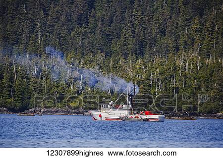 Smoke billows from the smoke stack of a commercial fishing boat on the waters of Main Bay, Prince William Sound, Whittier, Southcentral Alaska, USA, Summer View Large Photo Image Stock Photograph - Smoke billows from the smoke stack of a commercial fishing boat on the waters of Main Bay, Prince William Sound, Whittier, Southcentral Alaska, USA, Summer. Fotosearch
