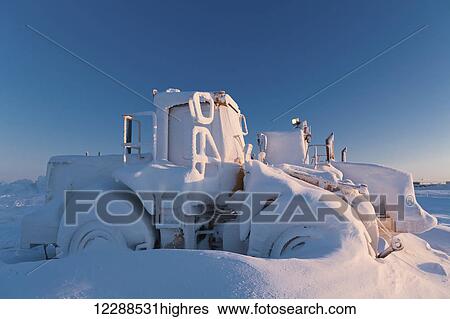 Snow covered loader, Prudhoe Bay, North Slope, Arctic Alaska View Large Photo Image Stock Photograph - Snow covered loader, Prudhoe Bay, North Slope, Arctic Alaska. Fotosearch