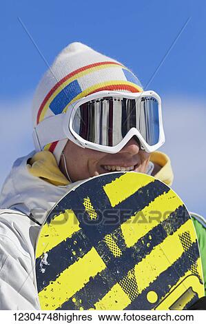 Stock Photograph - Snowboarder in goggles; Whistler, British Columbia, Canada. Fotosearch