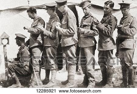 Soldiers during World War One sychronizing their watches with a clock mounted on a post in the camp. This was vital to obtain unanimity of movement and perfect co-operation before an attack. From The Pageant of the Century, published 1934 View Large Photo Image Stock Image - Soldiers during World War One sychronizing their watches with a clock mounted on a post in the camp. This was vital to obtain unanimity of movement and perfect co-operation before an attack. From The Pageant of the Century, published 1934. Fotosearch