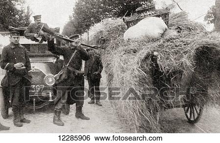 Soldiers looking for German spies search a haywagon using bayonets in Aarschot, Belgium during WWI. From The War Illustrated Album Deluxe, published 1915. View Large Photo Image Stock Photograph - Soldiers looking for German spies search a haywagon using bayonets in Aarschot, Belgium during WWI. From The War Illustrated Album Deluxe, published 1915.. Fotosearch
