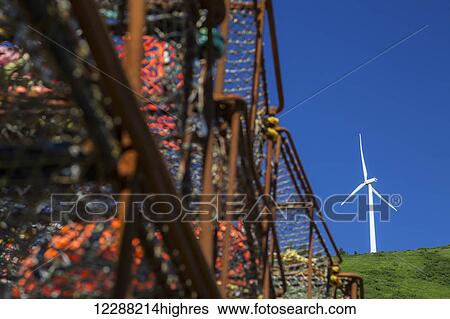 Stack of crab pots in front of wind turbine against blue sky, Kodiak Island, Southwest Alaska View Large Photo Image Stock Photograph - Stack of crab pots in front of wind turbine against blue sky, Kodiak Island, Southwest Alaska. Fotosearch