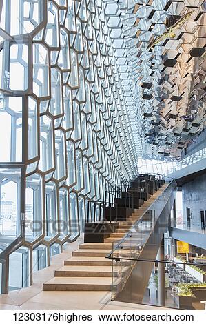 Stock Photograph - Stairs in the interior of the Harpa Public Concert Hall, designed by the Danish firm Henning Larsen Architects and the Icelandic firm Batteriao Architects, the glass facade designed by Icelandic glass artist Olafur Eliasson; Reykjavik, Iceland. Fotosearch