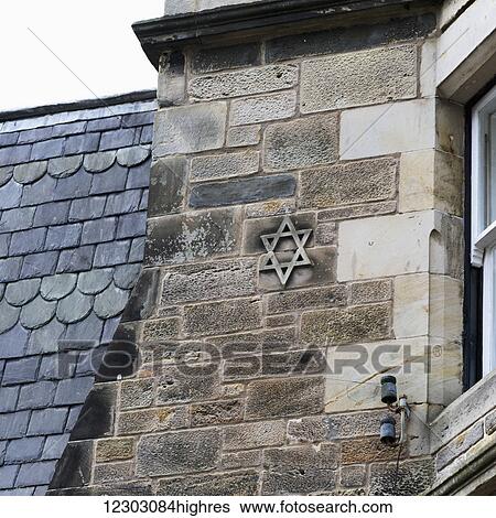 Stock Photograph - Star of David on the stone wall of a house; St. Andrews, Fife, Scotland. Fotosearch