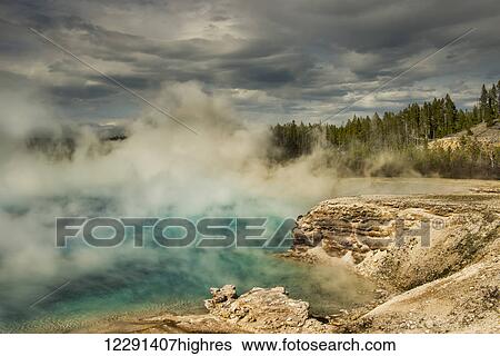 Steam rises from a pool near the Grand Prismatic Spring in Yellowstone National Park; Wyoming, United States of America View Large Photo Image Stock Photograph - Steam rises from a pool near the Grand Prismatic Spring in Yellowstone National Park; Wyoming, United States of America. Fotosearch