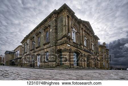 Stock Photograph - Stone building on a cobblestone road under a cloudy sky; South Shields, Tyne and Wear, England. Fotosearch