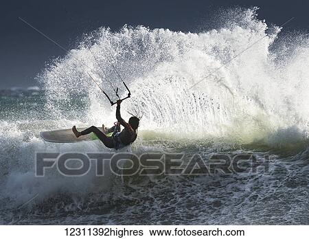 Stock Photograph - Strapless kitesurfing; Tarifa, Cadiz, Andalusia, Spain. Fotosearch