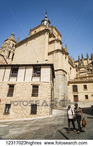 Stock Photograph - Street in the downtown of Segovia with the tower of the Cathedral in the background; Segovia, Castilla Leon, Spain. Fotosearch